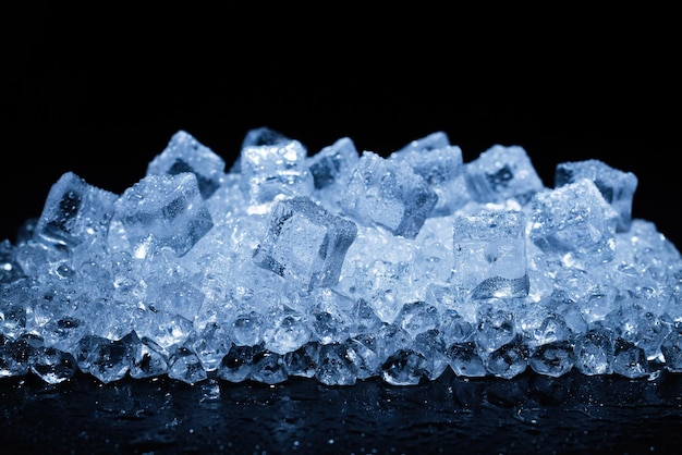 Ice crystal cubes on a black background, space for text or design.