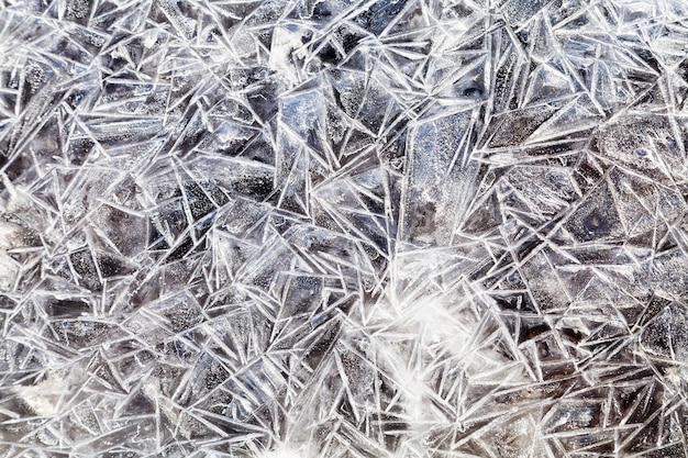 Ice crystals over frozen puddle