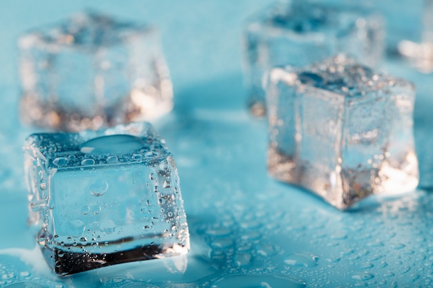 Ice cubes are scattered with water drops scattered Close up.