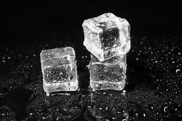 Ice cubes on black table