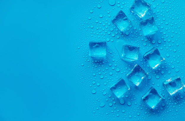 Ice cubes on a blue background Selective focus