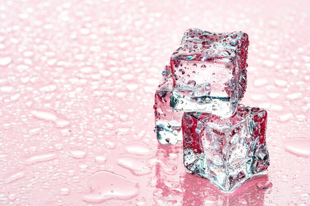 Ice cubes on pink  