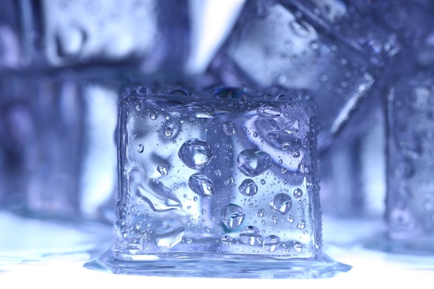 Ice cubes on white wall.