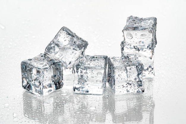 Ice cubes on white wall.