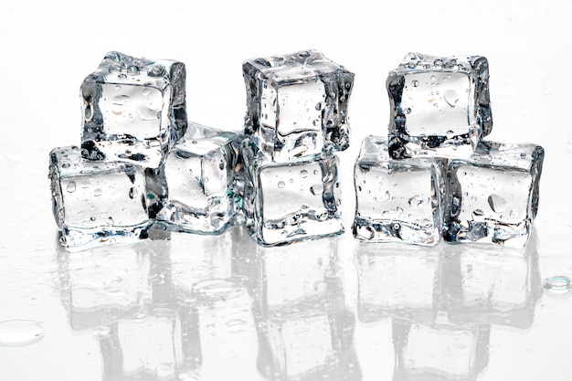 Ice cubes on white .