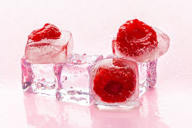 Ice cubes with berry for summer cocktails