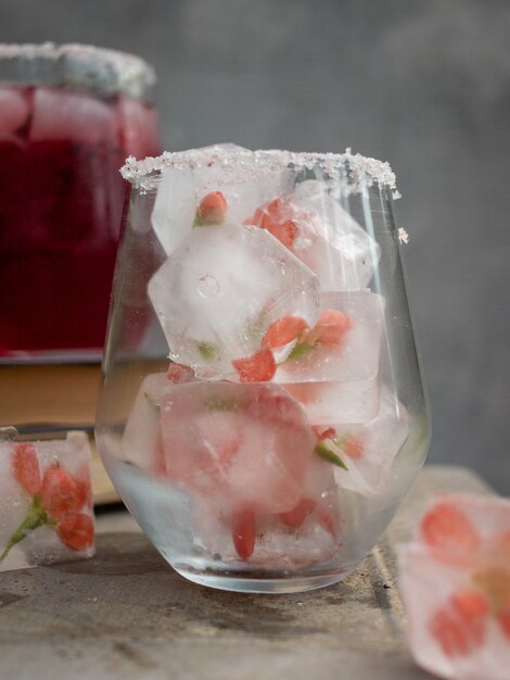 ice cubes with flowers in a glass