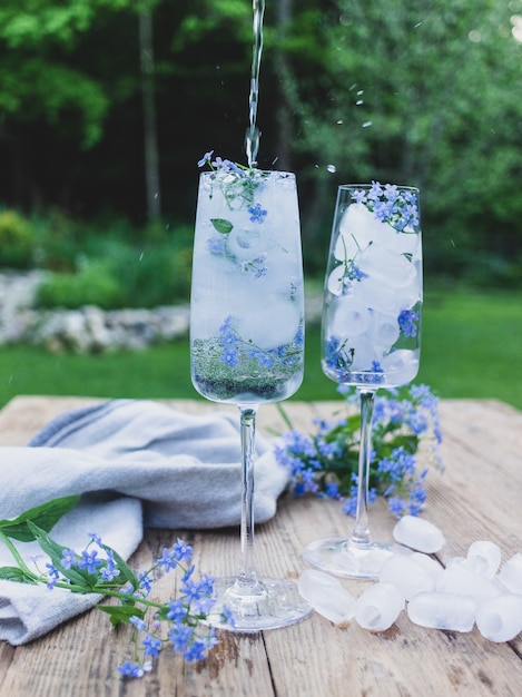 ice cubes with flowers in a glass