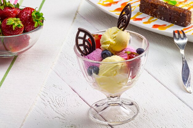 Ice dessert on the table with white planks