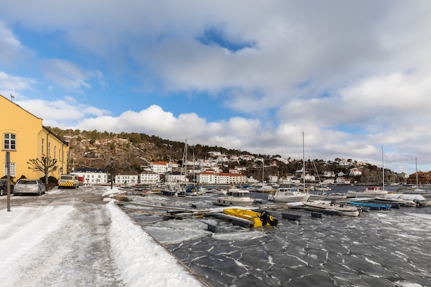 Ice floes on the fjord in the city and harbour of Risor, a small town in the south part of Norway