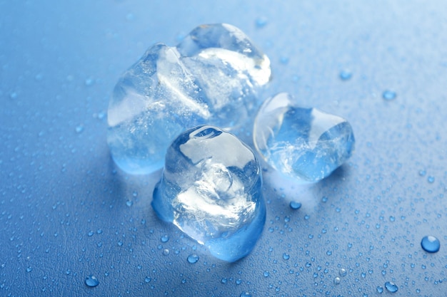 Ice forms on blue background close up