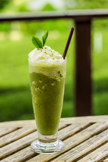 ice green tea smoothie on wooden table