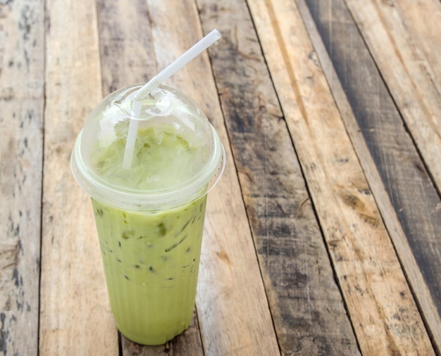 Ice green tea on wooden table