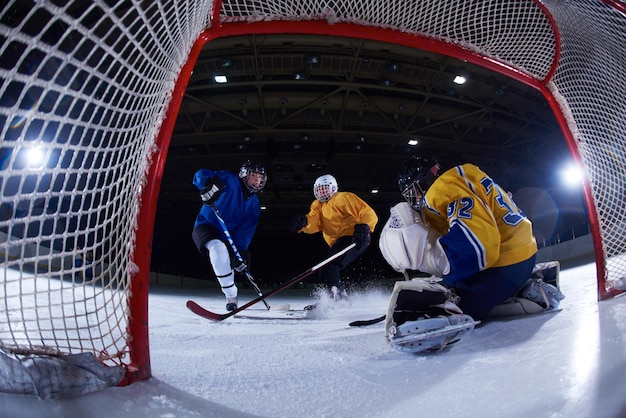 ice hockey goalkeeper  player on goal in action