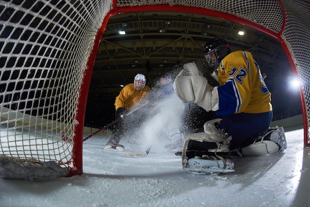 ice hockey goalkeeper  player on goal in action