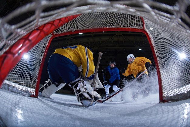 ice hockey goalkeeper  player on goal in action