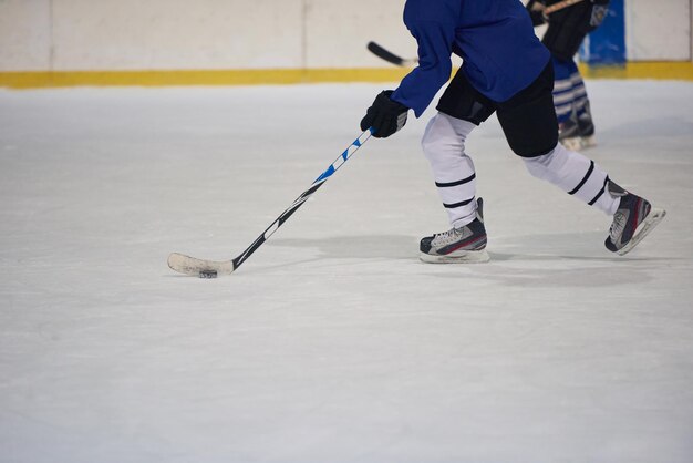 ice hockey player in action kicking with stick