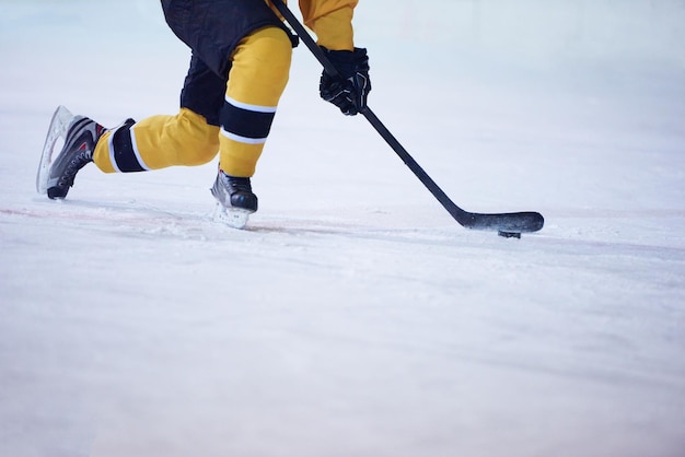 ice hockey player in action kicking with stick