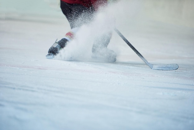 ice hockey player in action kicking with stick