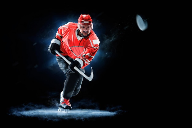 ice hockey player isolated on black background