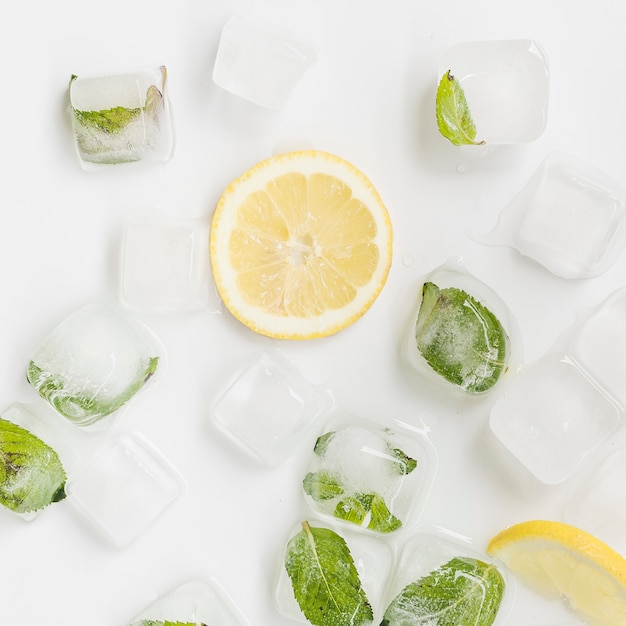 Ice and lemon on white background