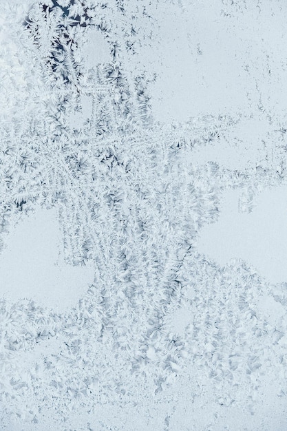 Ice patterns on frozen glass Abstract ice pattern on winter glass as a background image