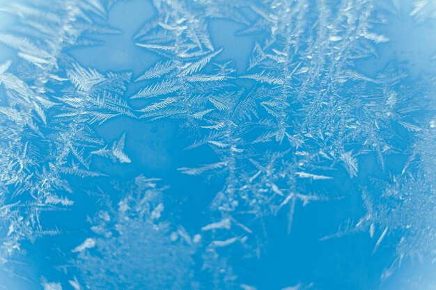 Modelli di ghiaccio sul vetro congelato modello astratto di ghiaccio sul vetro invernale come immagine di sfondo