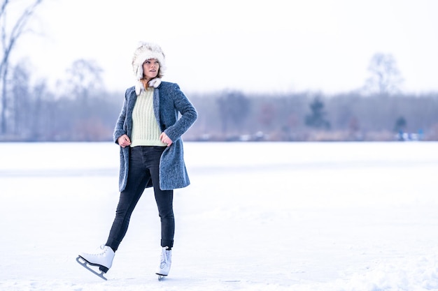 Ice skating on a frozen pond in winter