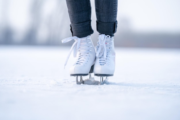 Ice skating on a frozen pond in winter