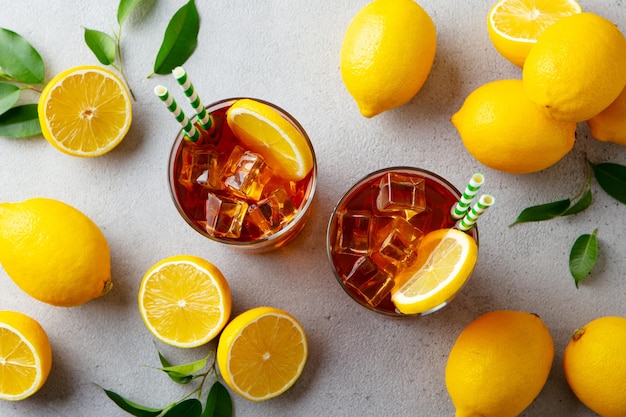 Ice tea with fresh lemons Grey background Close up Top view