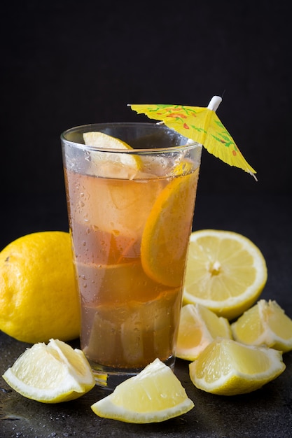 Ice tea with lemon on black