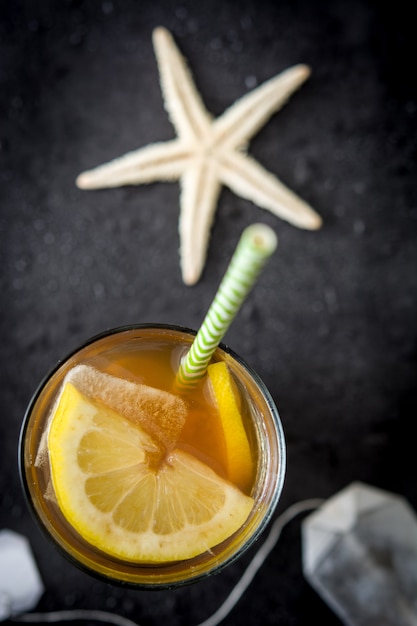 Ice tea with lemon top view copy space