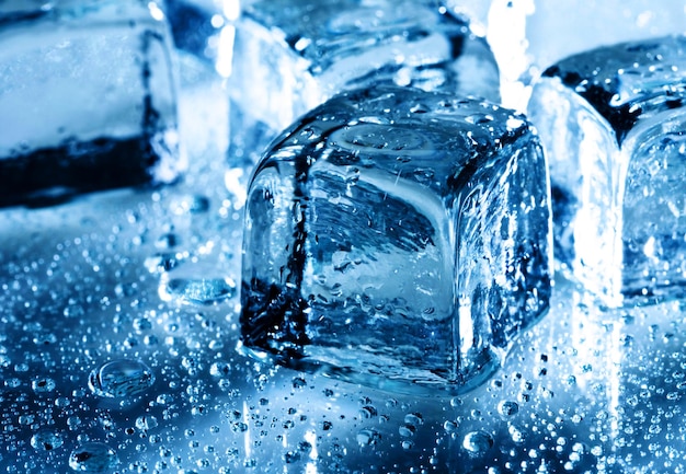 Ice with water droplets over abstract wet background