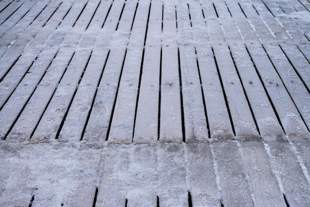 Ice on wooden desks planks