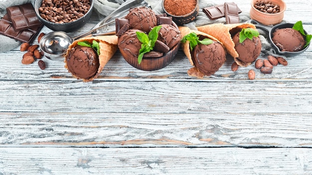 Icecream with chocolate on a white wooden background Top view Free space for your text