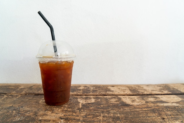 iced americano black coffee glass on wood table