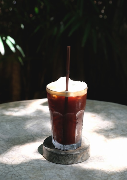 Iced americano on rock table