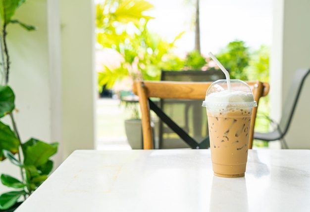 Iced cappuccino coffee glass on table