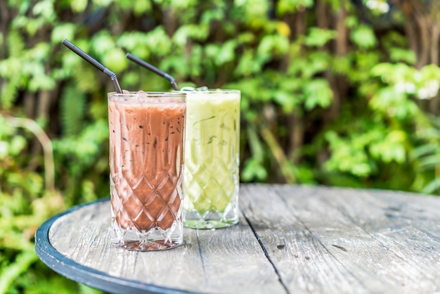 iced chocolate and matcha green tea glass on the table