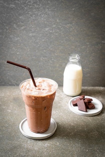 Iced chocolate milkshake drink on wood slice