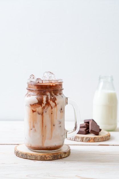 Iced chocolate milkshake drink on wood