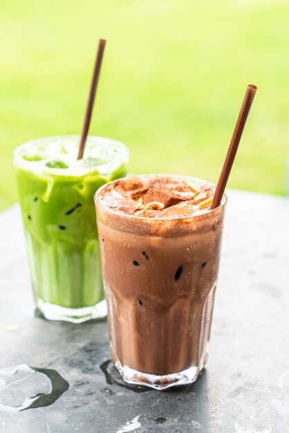 iced chocolate milkshake and iced green tea with milk