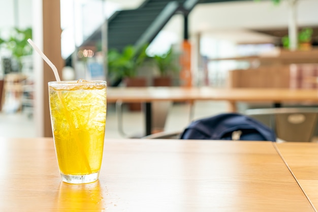 iced Chrysanthemum juice on wood table in cafe restaurant