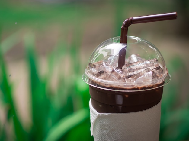 Iced cocoa in high plastic glass.