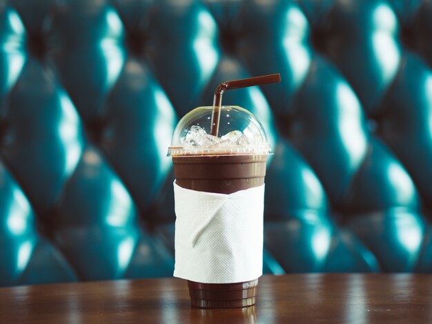 Iced cocoa in high plastic glass.