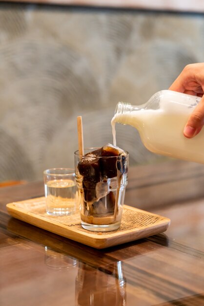 iced coffee cube in glass with milk 