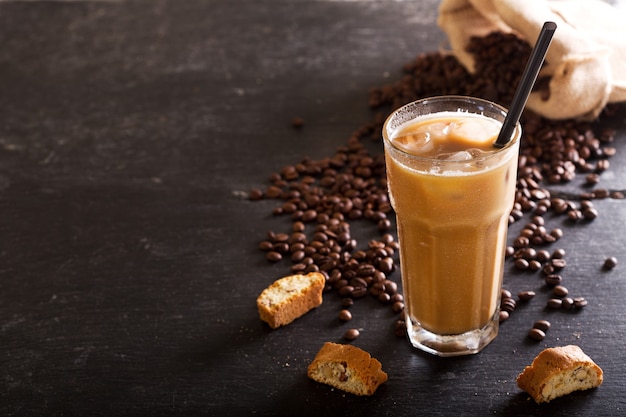 Iced coffee in a glass on dark table