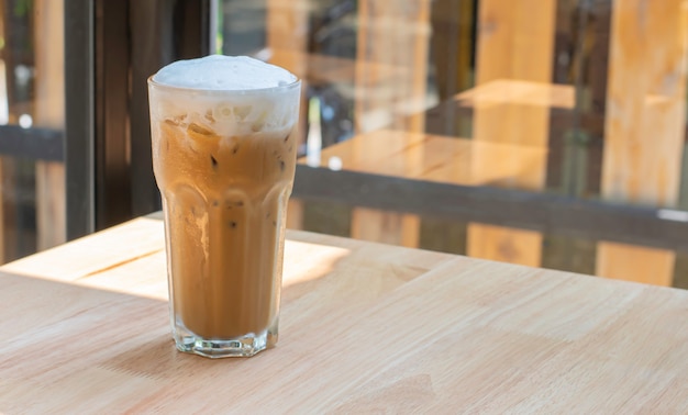 Iced Coffee in glass on the wooden table 