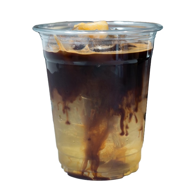 Iced coffee in plastic cup on table in coffee shop