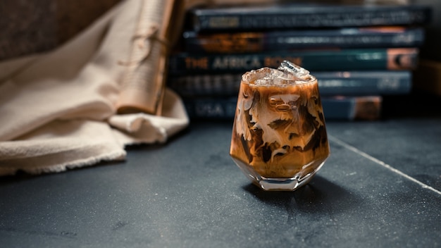 iced coffee served on black table at cafe